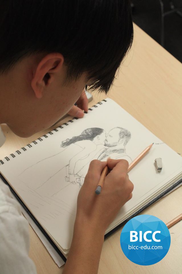 a boy drawing a sketch of a couple