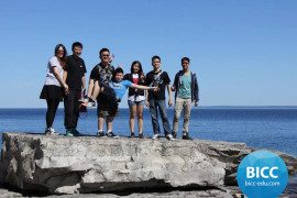 a group of students enjoying at the beach