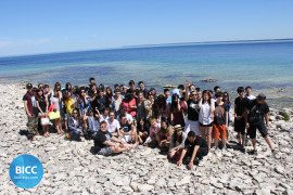 a big group of students at the beach