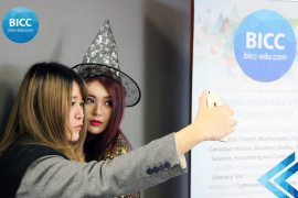 two girls clicking a selfie at the BICC event