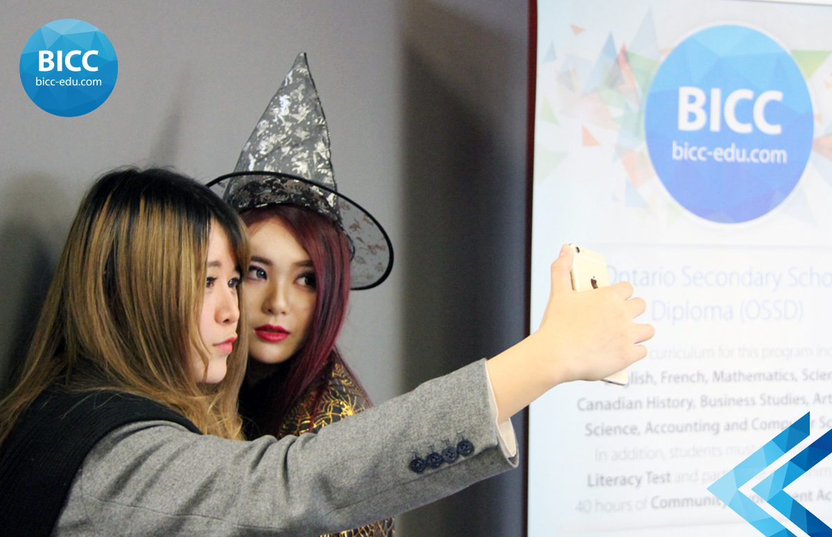 two girls clicking a selfie at the BICC event